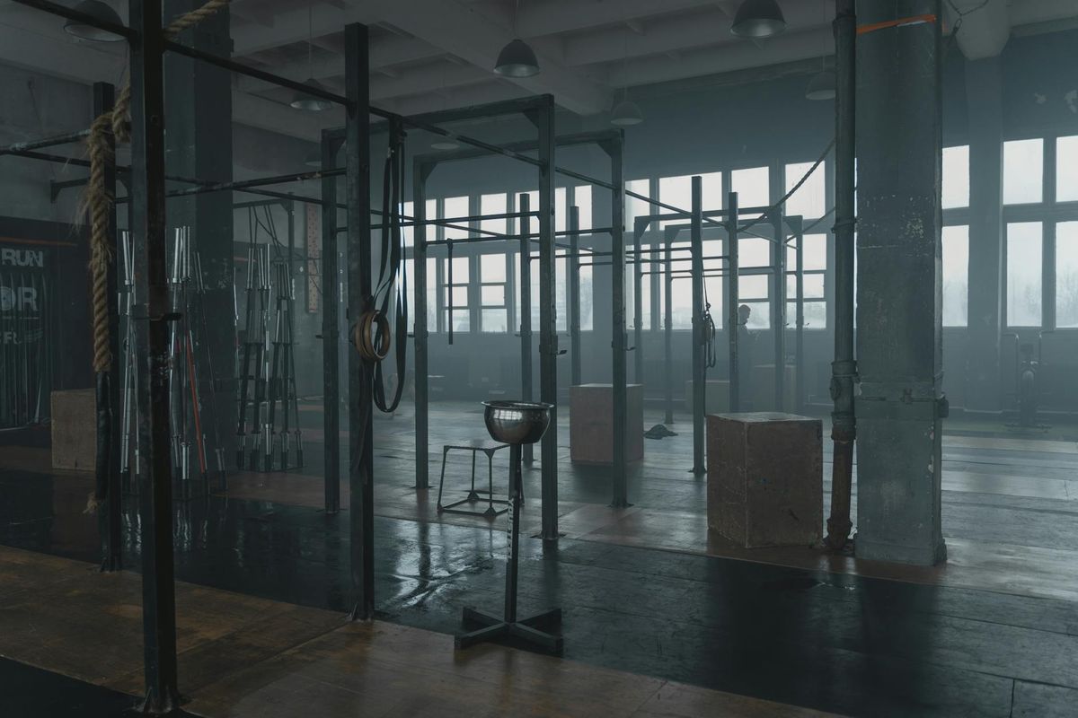 Close up of gym equipment in a dark industrial space.